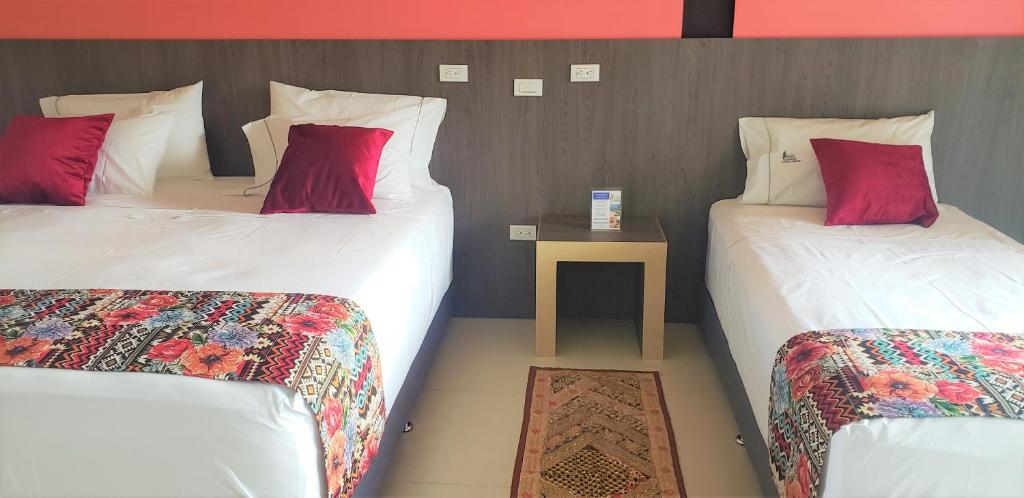 Postel nebo postele na pokoji v ubytování Villa Juana Hotel