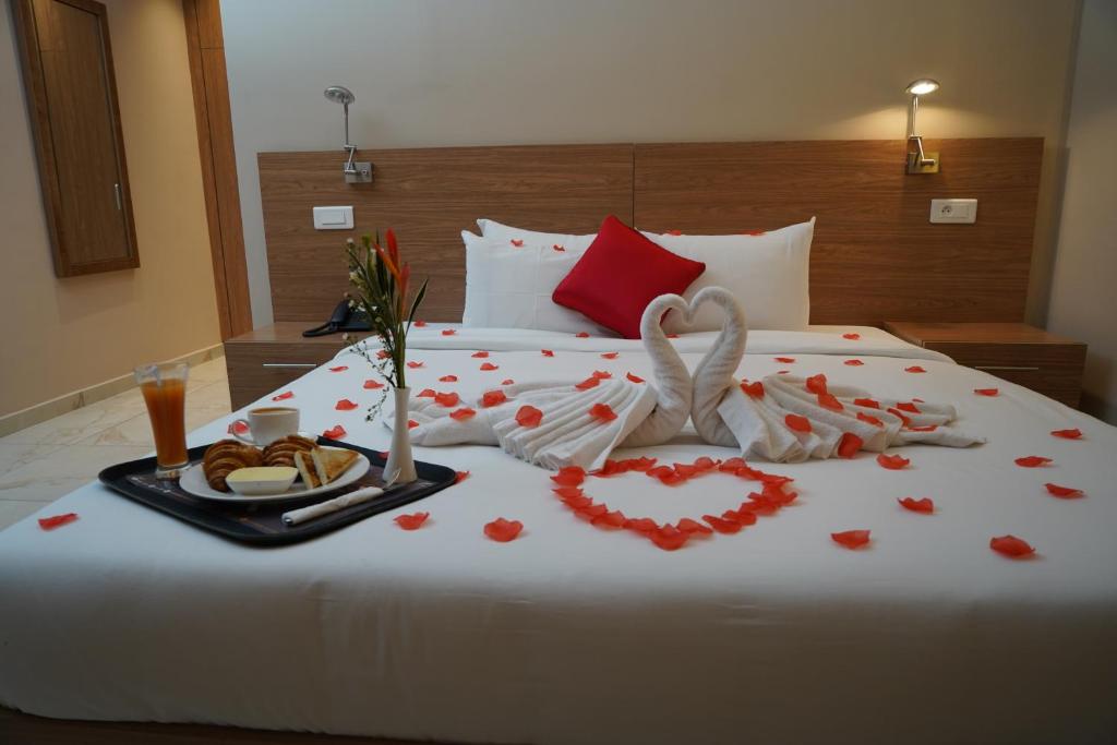 Postel nebo postele na pokoji v ubytování HOTEL ASTRAL
