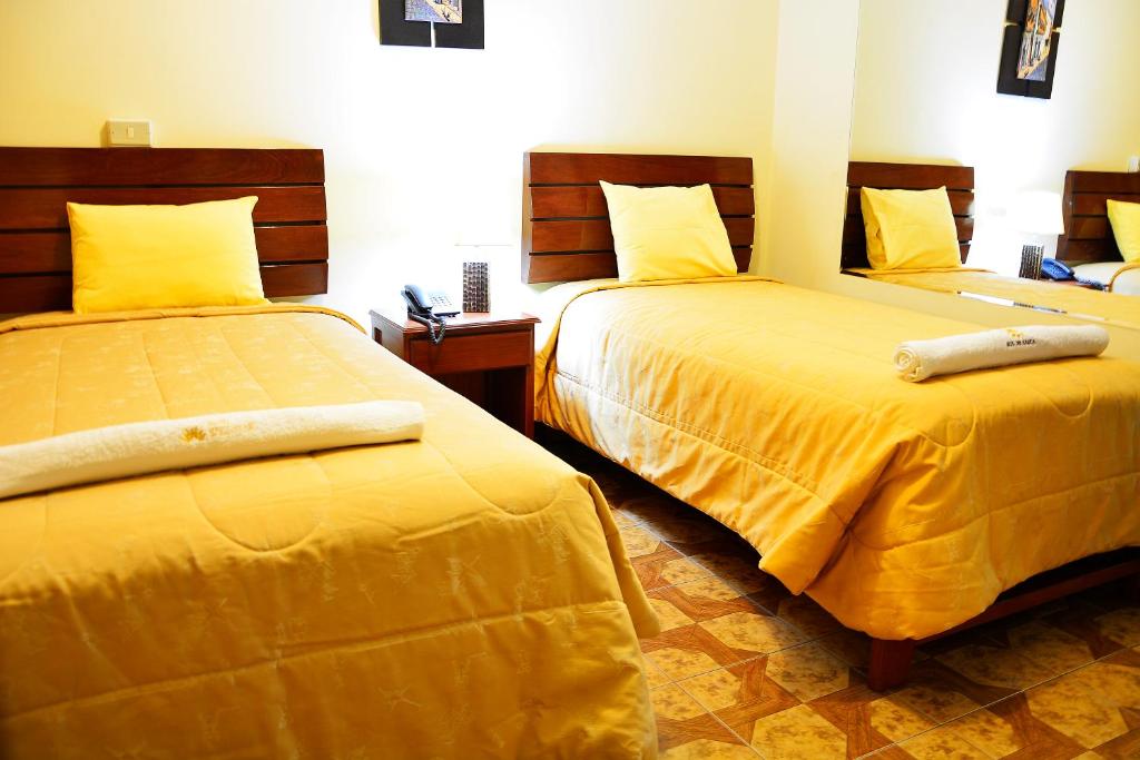 Postel nebo postele na pokoji v ubytování Hotel Sol del Sur