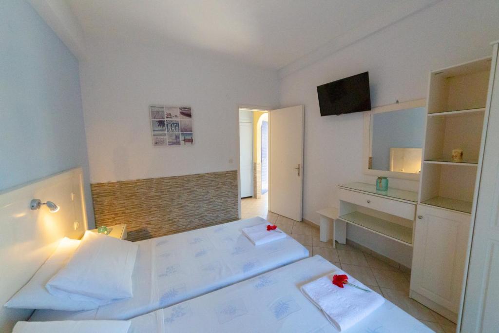 Postel nebo postele na pokoji v ubytování Angelina Apartments