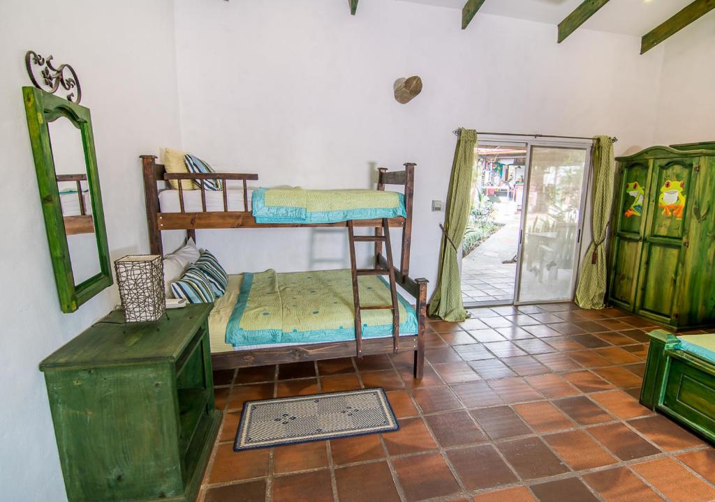 Postel nebo postele na pokoji v ubytování Villa Margarita