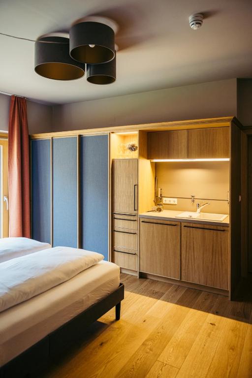 Posteľ alebo postele v izbe v ubytovaní Appartementhotel am Weissensee