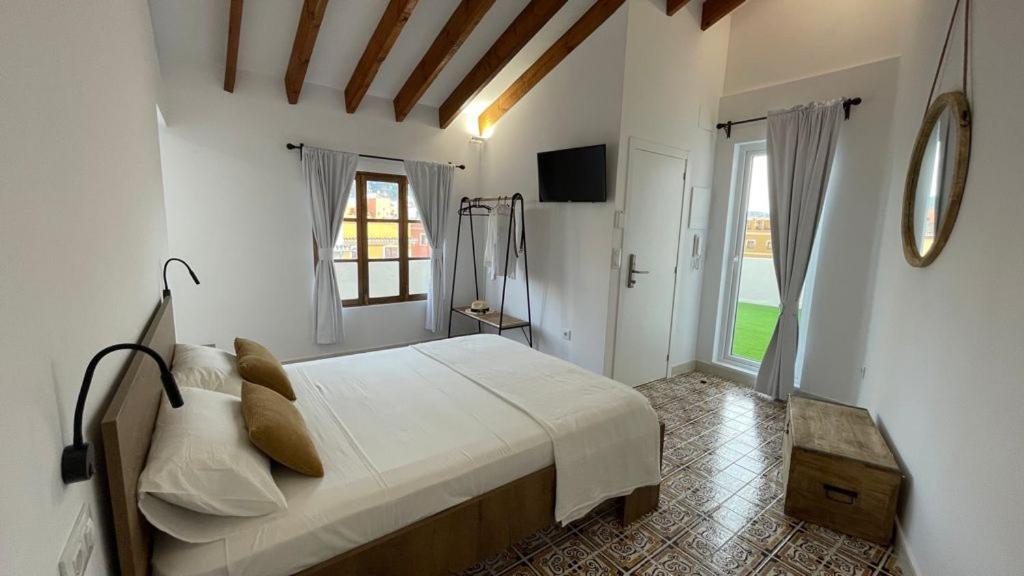 Postel nebo postele na pokoji v ubytování Mi Villa Apartamentos Dénia Centro