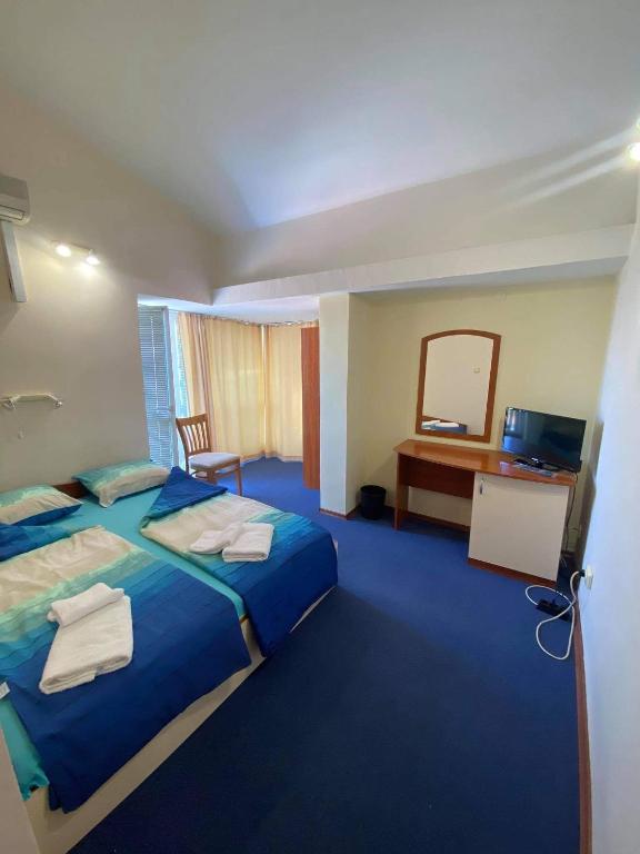 Postel nebo postele na pokoji v ubytování Family hotel Neptun - Lozenets