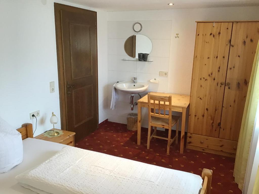 A bed or beds in a room at Haus Resi