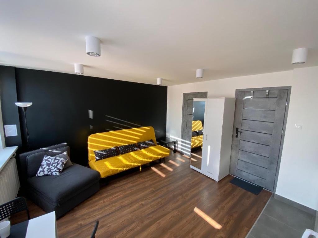 Łóżko lub łóżka w pokoju w obiekcie Apartamenty Czapla