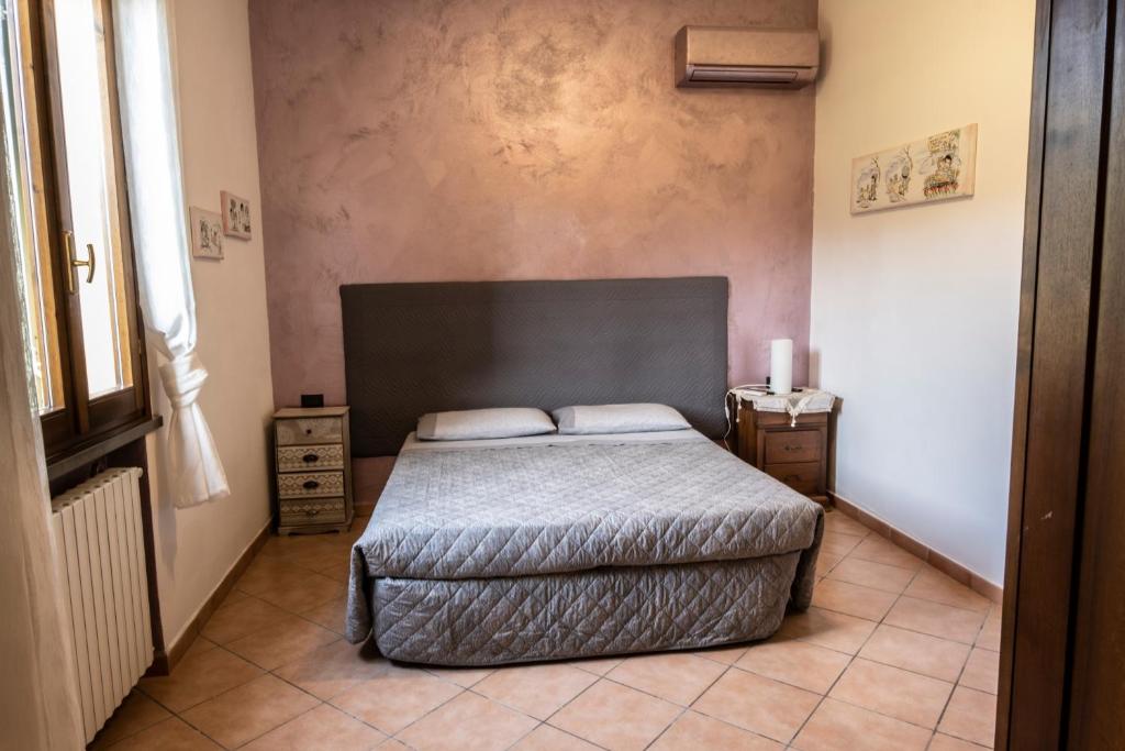 Postel nebo postele na pokoji v ubytování B&B La Serra