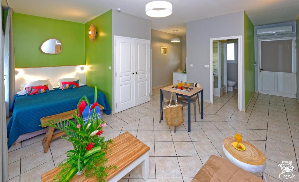 Postel nebo postele na pokoji v ubytování Village Creole