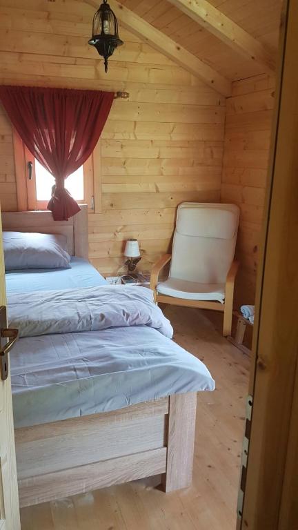 Postel nebo postele na pokoji v ubytování EtnoPetra