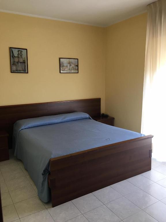 Postel nebo postele na pokoji v ubytování Hotel PINO LORICATO