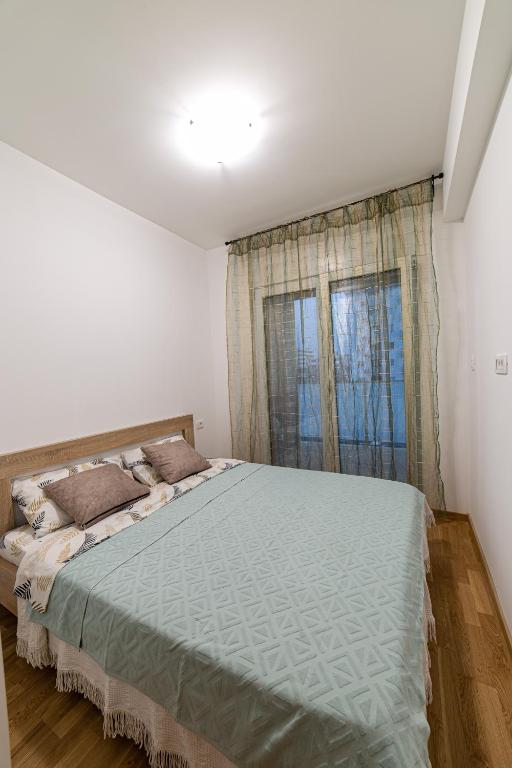 Postel nebo postele na pokoji v ubytování Apartman Miss T