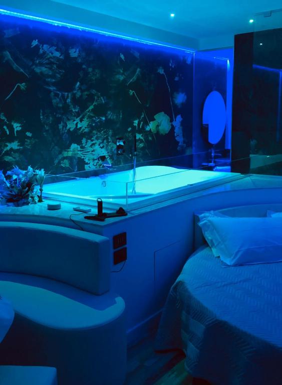 Postel nebo postele na pokoji v ubytování Assisi Luxury SPA Suite Superior