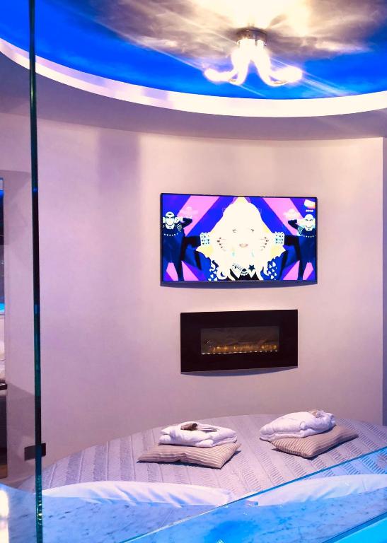 Postel nebo postele na pokoji v ubytování Assisi Luxury SPA Suite Superior