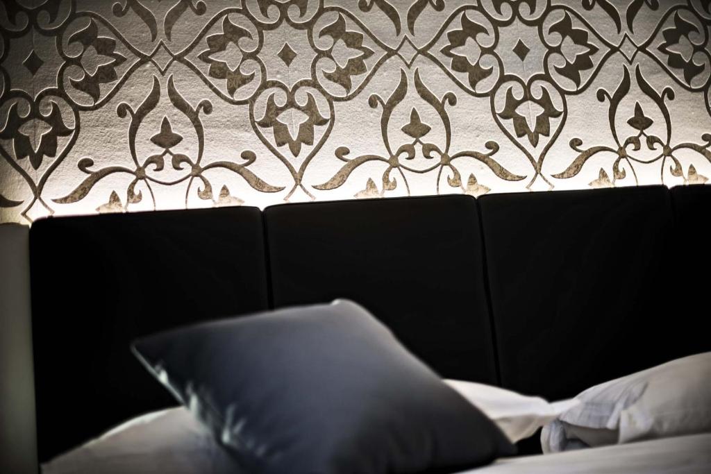 Łóżko lub łóżka w pokoju w obiekcie Ilga Hotel