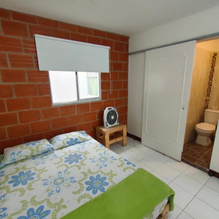 Postel nebo postele na pokoji v ubytování Hostal paz y vida