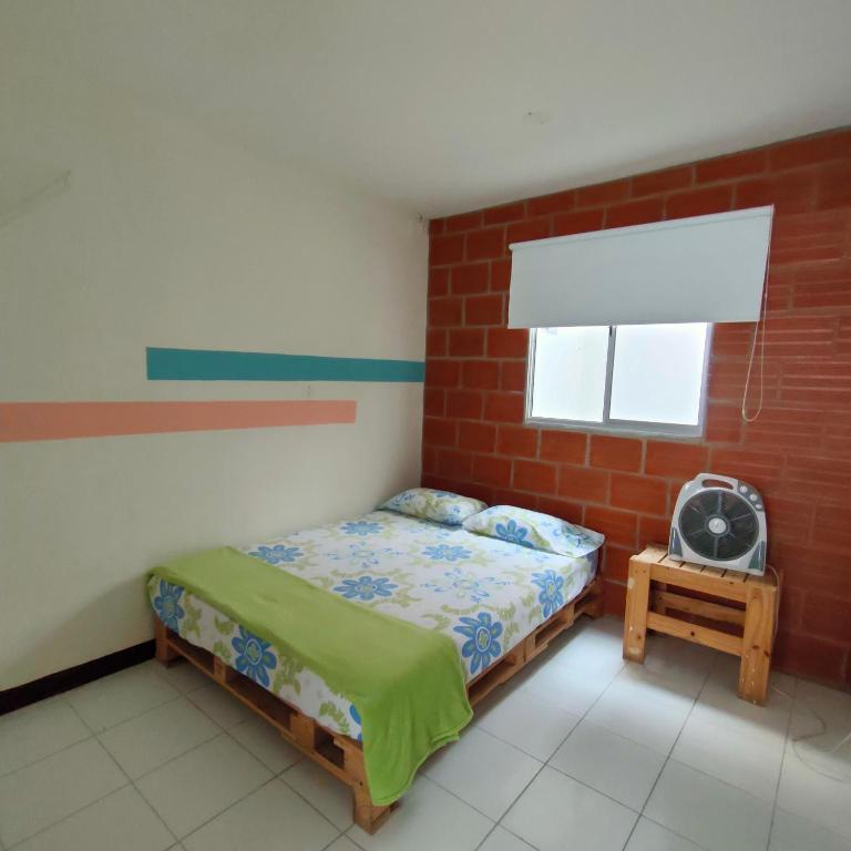 Postel nebo postele na pokoji v ubytování Hostal paz y vida
