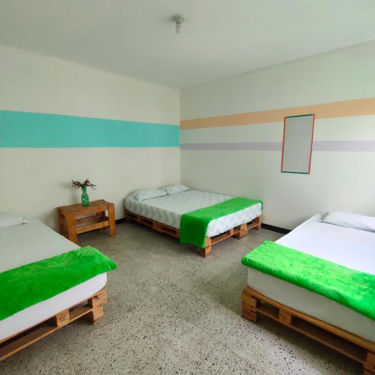 Postel nebo postele na pokoji v ubytování Hostal paz y vida