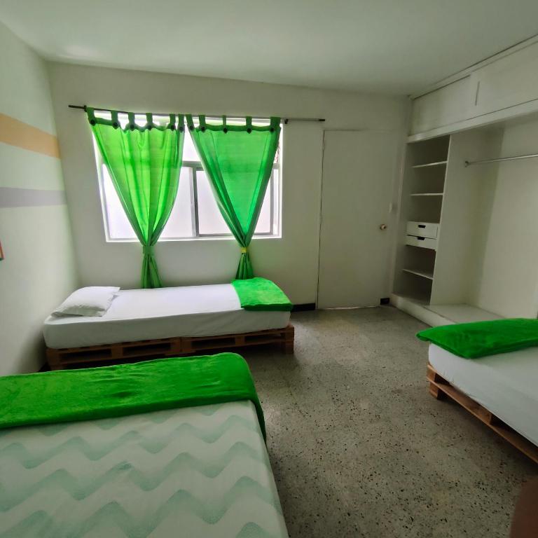 Postel nebo postele na pokoji v ubytování Hostal paz y vida