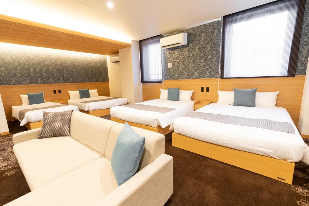 Postel nebo postele na pokoji v ubytování Chiyokura HOTEL SHUKU Nagoya