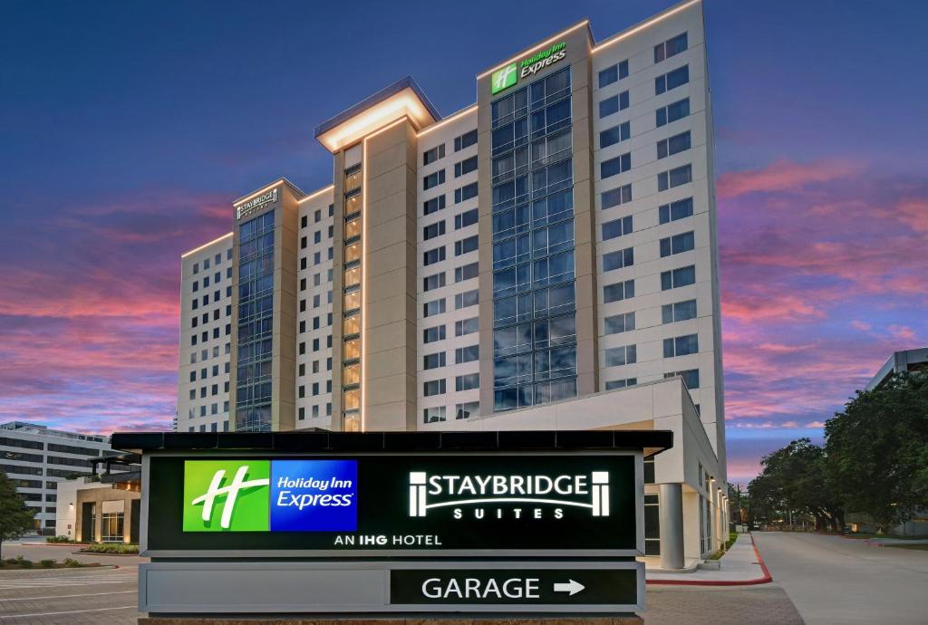 a large building with a sign in front of it at Staybridge Suites - Houston - Galleria Area, an IHG Hotel in Houston