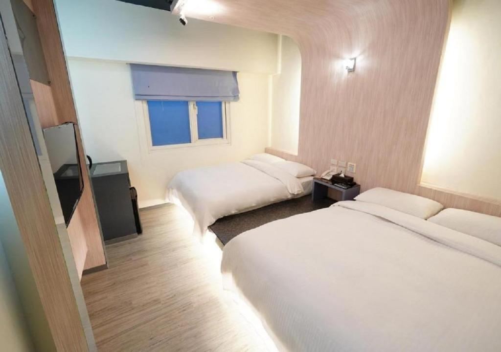 Voodi või voodid majutusasutuse Walker Hotel - Sanchong toas