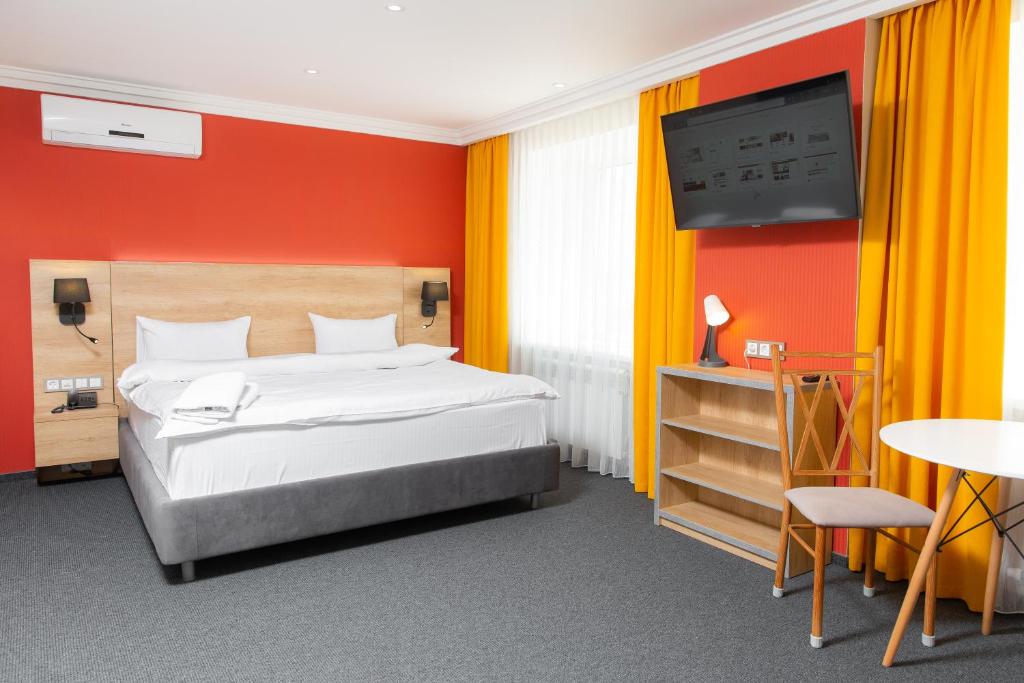 
Кровать или кровати в номере Гостиница Кокшетау
