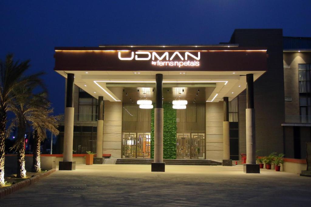 a building with a sign on the front of it at Udman Greater Noida By Ferns N Petals, 4km from Expo Centre in Greater Noida