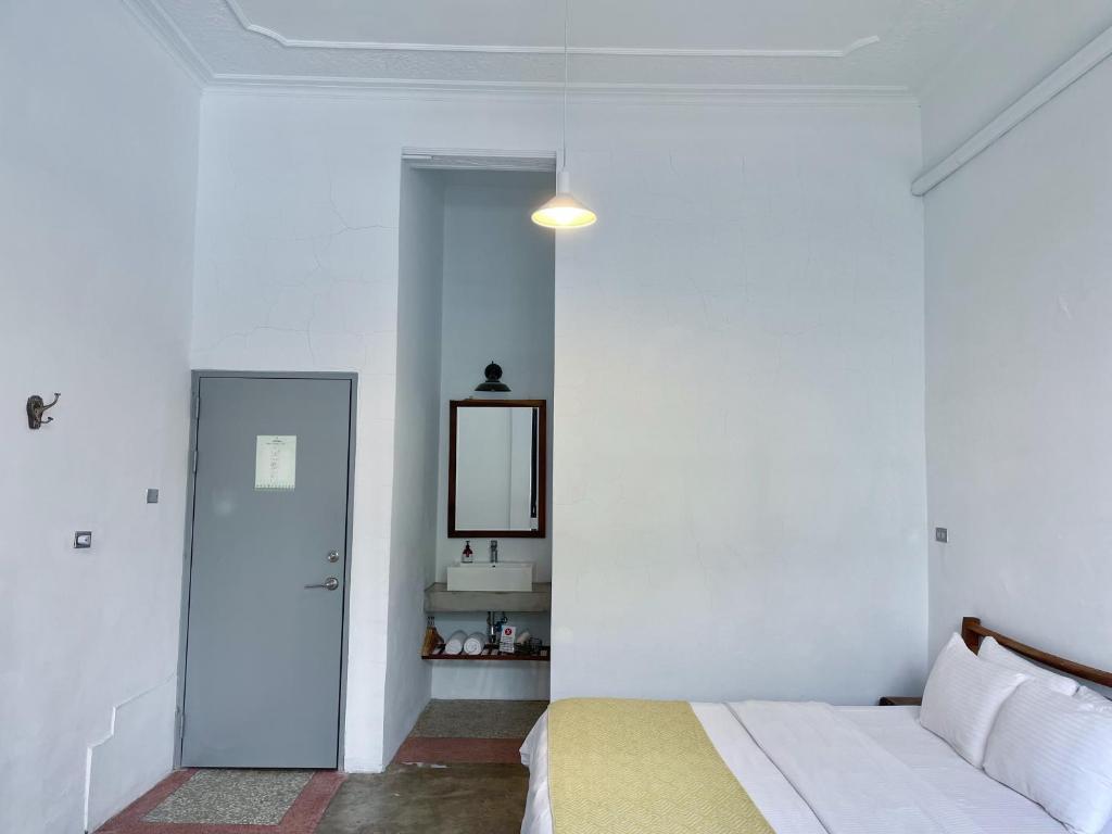 Postel nebo postele na pokoji v ubytování 8 Door老宅民宿