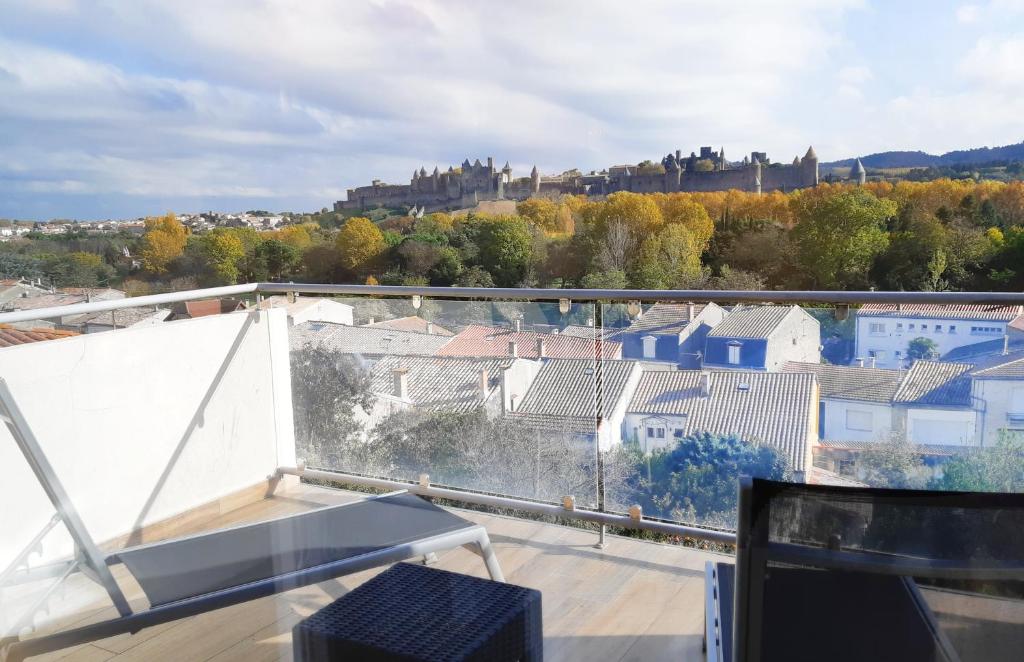 a balcony with a view of a city at Les Suites du Saint Nazaire - Les Balcons de la Cité in Carcassonne