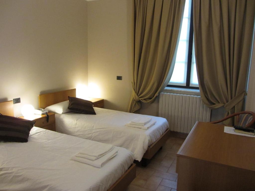 Postel nebo postele na pokoji v ubytování Villa Lomellini