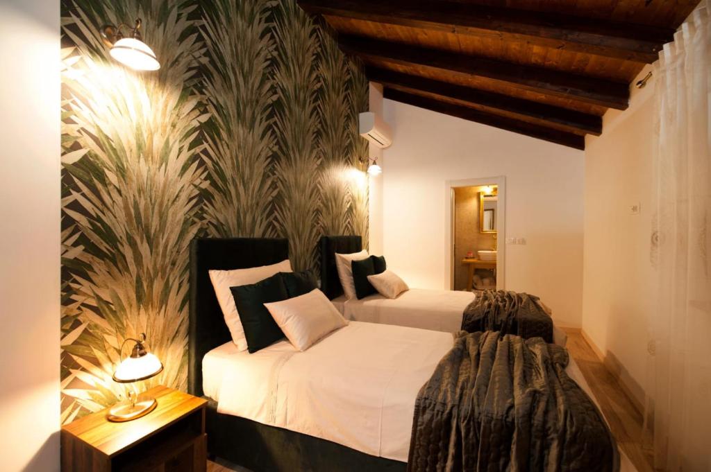 a bedroom with a bed and a wall mural at Luxury Villa Nature with heated private pool, sauna & fire pit, a short walk to the beach in Milna