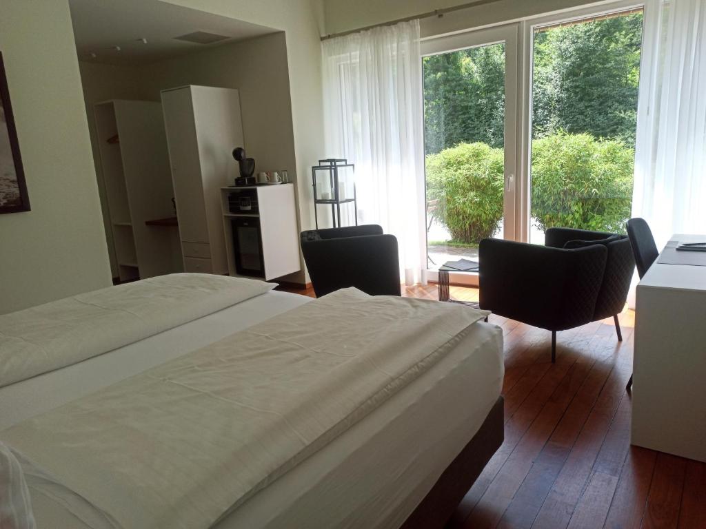 Postel nebo postele na pokoji v ubytování MotelplusHotel BiggeSeeFront