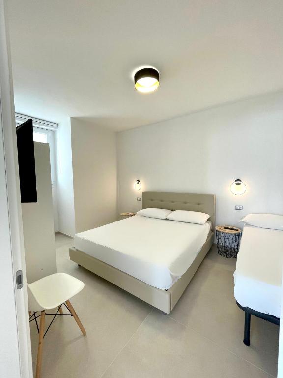 Posteľ alebo postele v izbe v ubytovaní Appartamento Gardenia Deluxe