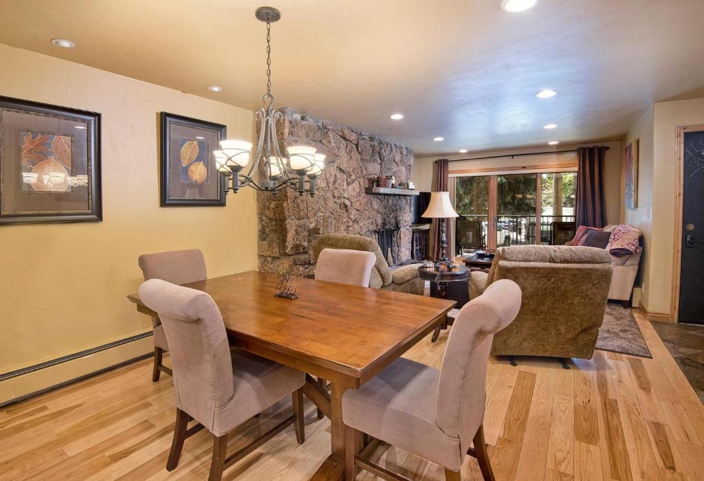a dining room with a wooden table and chairs at Beaver Creek West 14 in Avon