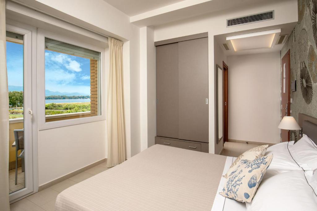 Postel nebo postele na pokoji v ubytování Hotel Miramare