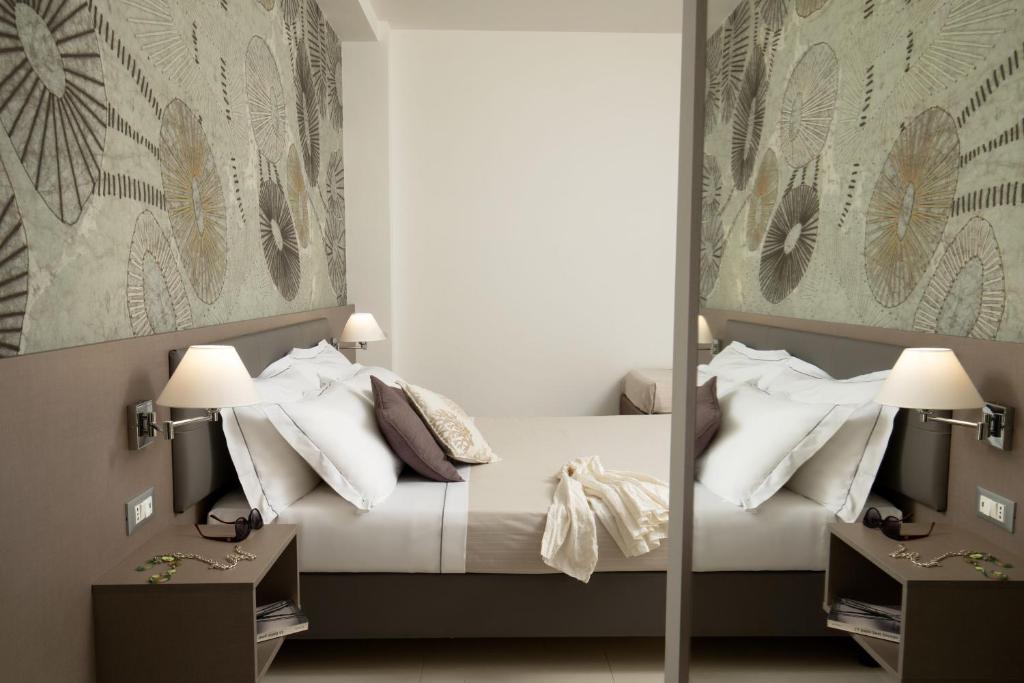 Postel nebo postele na pokoji v ubytování Hotel Miramare