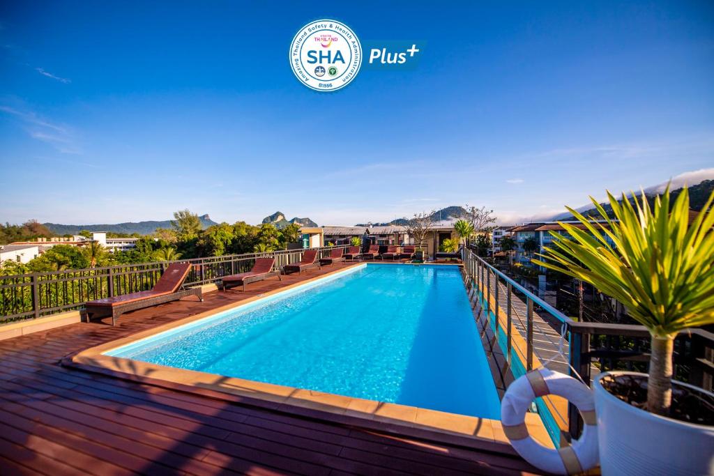 a swimming pool on the deck of a house at Navinda Krabi - SHA Plus in Ao Nang Beach