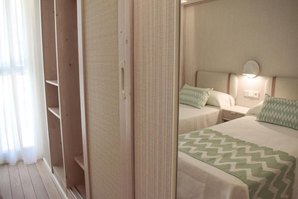 Postel nebo postele na pokoji v ubytování Ambassador Playa II