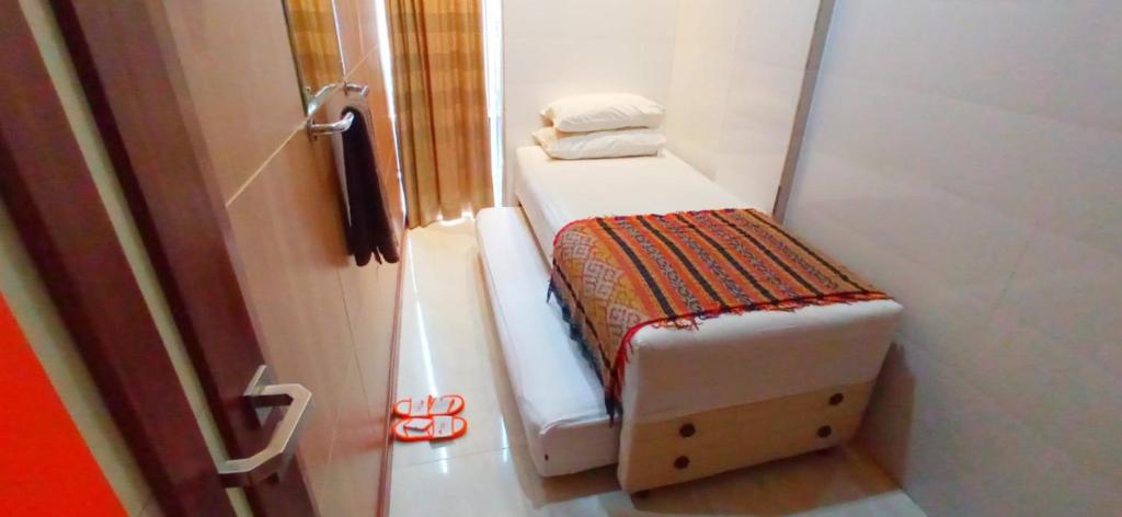 Postel nebo postele na pokoji v ubytování The Cabin Hotel Gandekan