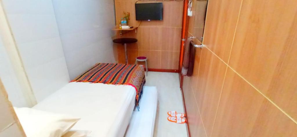 Postel nebo postele na pokoji v ubytování The Cabin Hotel Gandekan