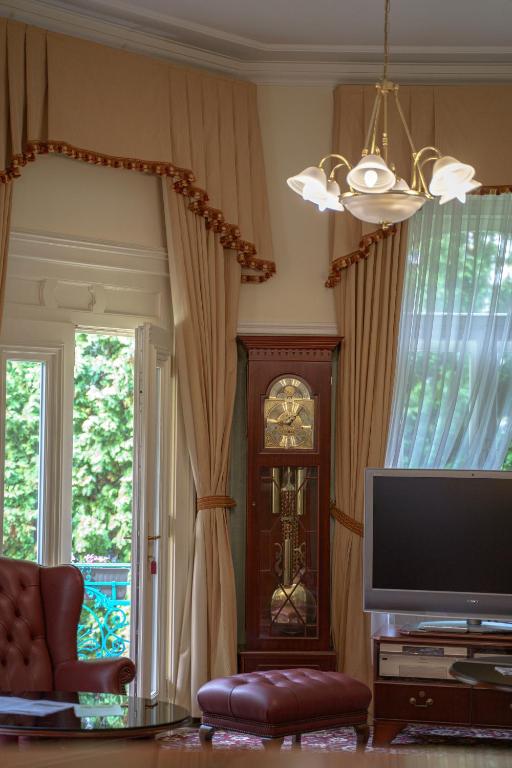 TV a/nebo společenská místnost v ubytování Hotel Mignon