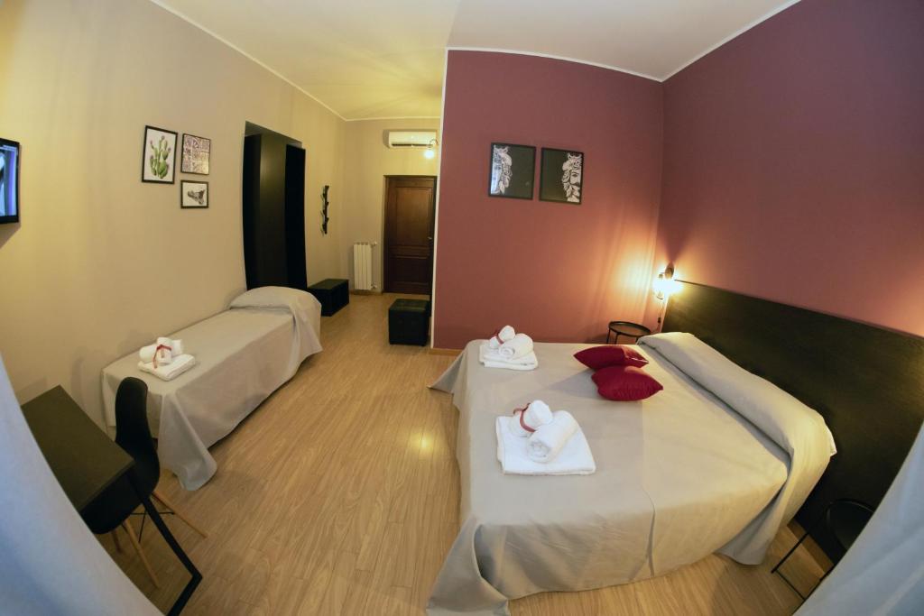 Posteľ alebo postele v izbe v ubytovaní Hotel Marconi