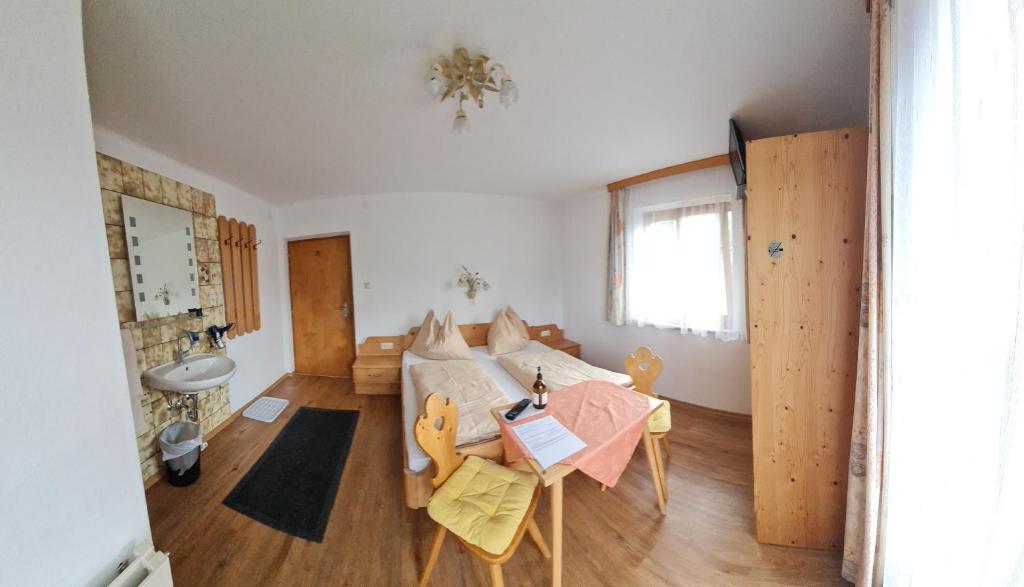 Postel nebo postele na pokoji v ubytování Haus Straif