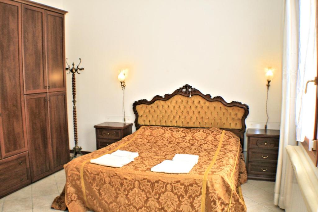 Posteľ alebo postele v izbe v ubytovaní Queen House Venezia
