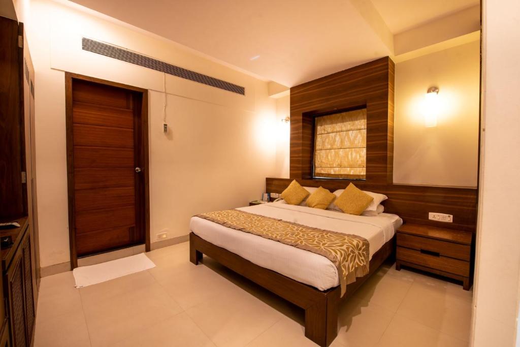 Postel nebo postele na pokoji v ubytování La-Paz Gardens Beacon Hotel - Vasco da Gama Goa