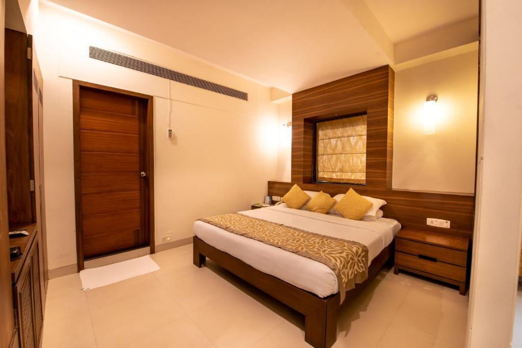Postel nebo postele na pokoji v ubytování La-Paz Gardens Beacon Hotel - Vasco da Gama Goa