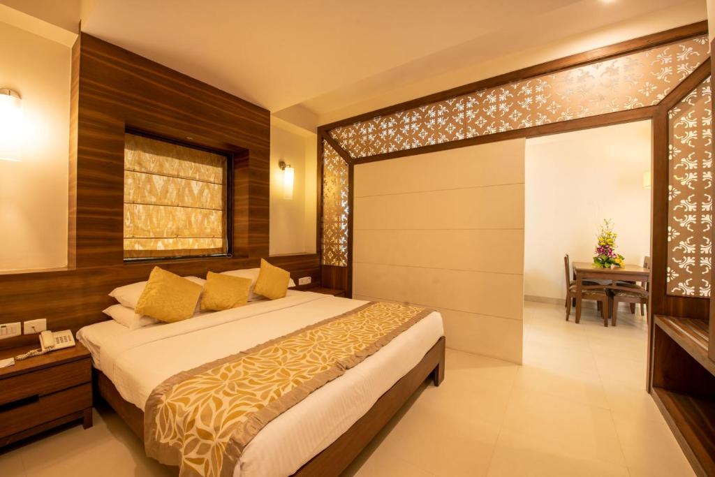 Postel nebo postele na pokoji v ubytování La-Paz Gardens Beacon Hotel - Vasco da Gama Goa
