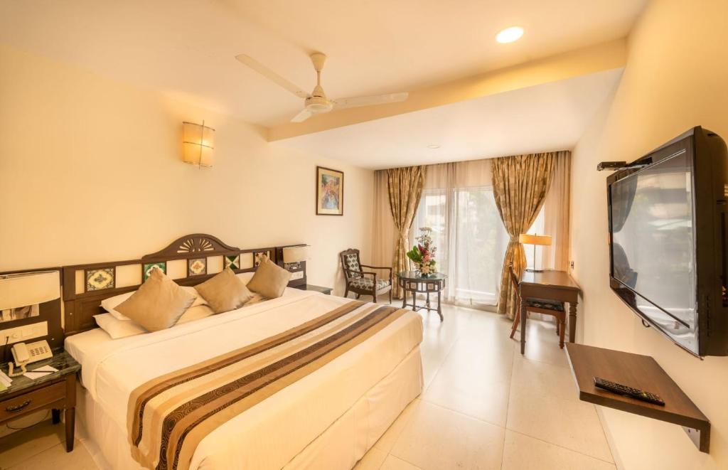 Postel nebo postele na pokoji v ubytování La-Paz Gardens Beacon Hotel - Vasco da Gama Goa
