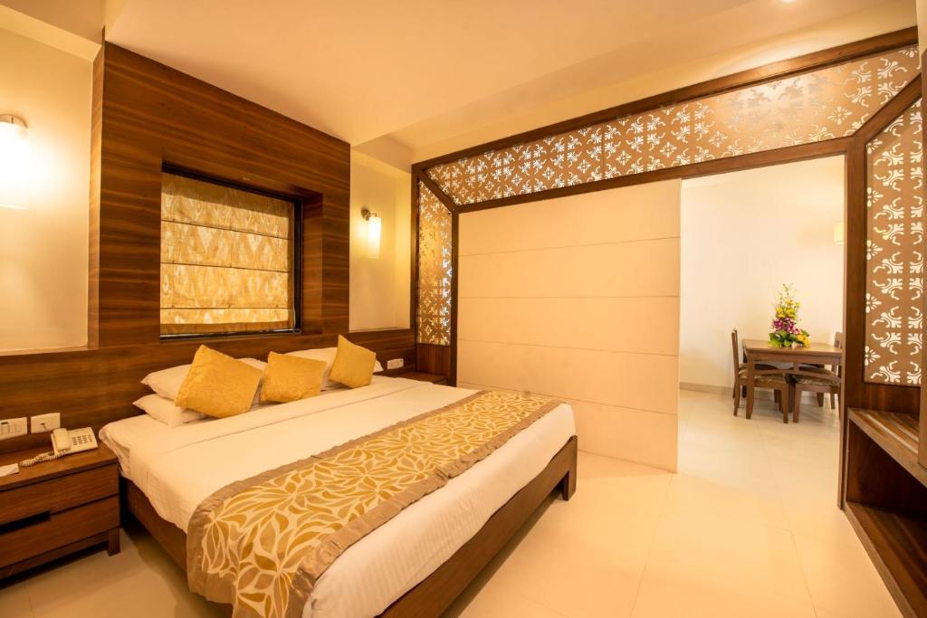 Postel nebo postele na pokoji v ubytování La-Paz Gardens Beacon Hotel - Vasco da Gama Goa