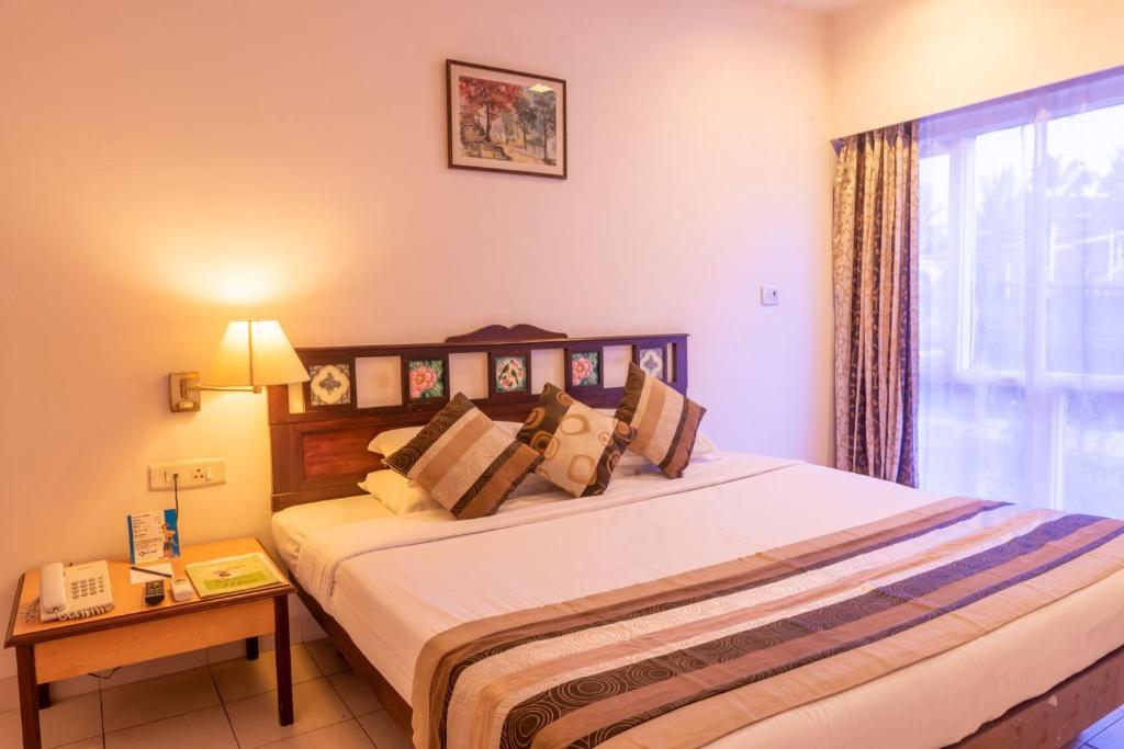 Postel nebo postele na pokoji v ubytování La-Paz Gardens Beacon Hotel - Vasco da Gama Goa